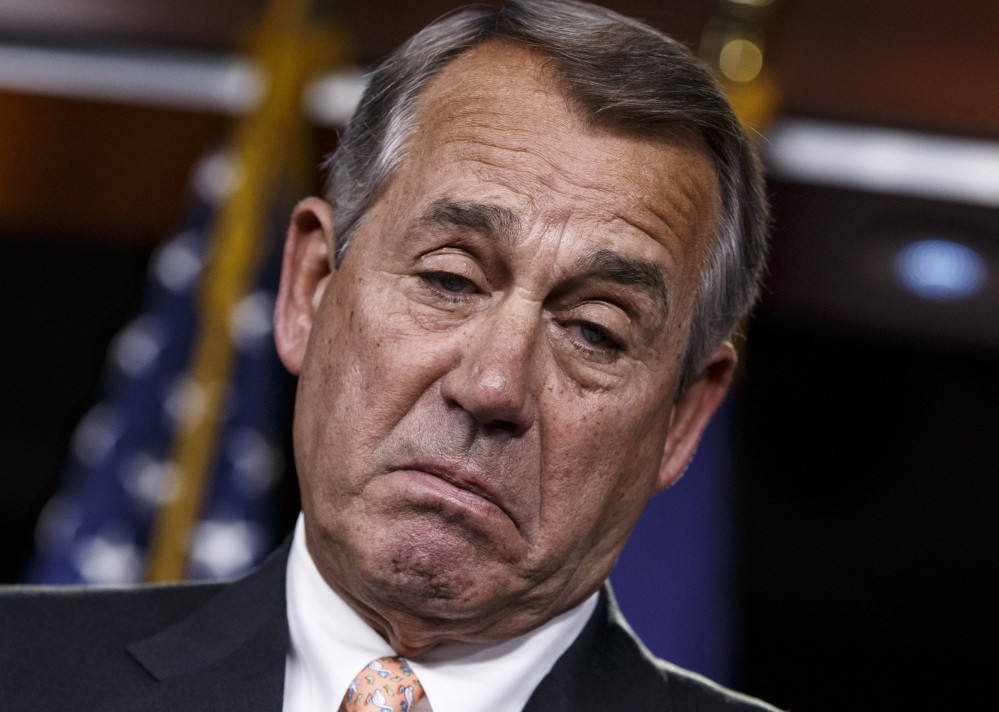 House Speaker John Boehner of Ohio responds to reporters about the impasse over passing the Homeland Security budget because of Republican efforts to block President Barack Obama’s executive actions on immigration on Thursday. Progress toward stop-gap funding was made Friday.