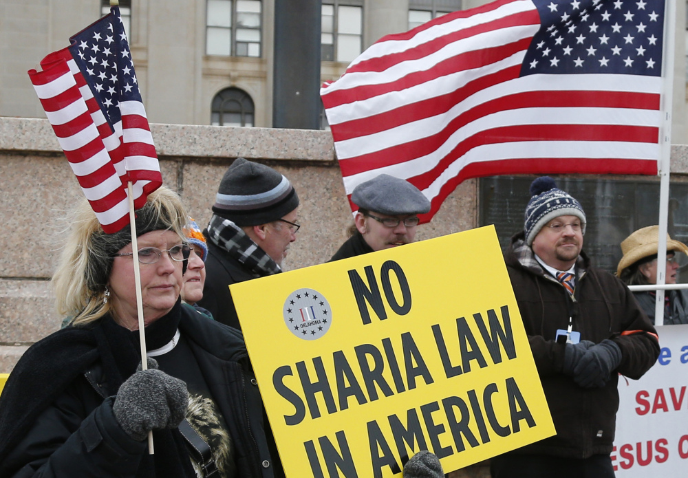 Protesters in Oklahoma City stand outside the state Capitol during the first-ever Muslim Day, designed to foster civic participation among the state’s Muslims.