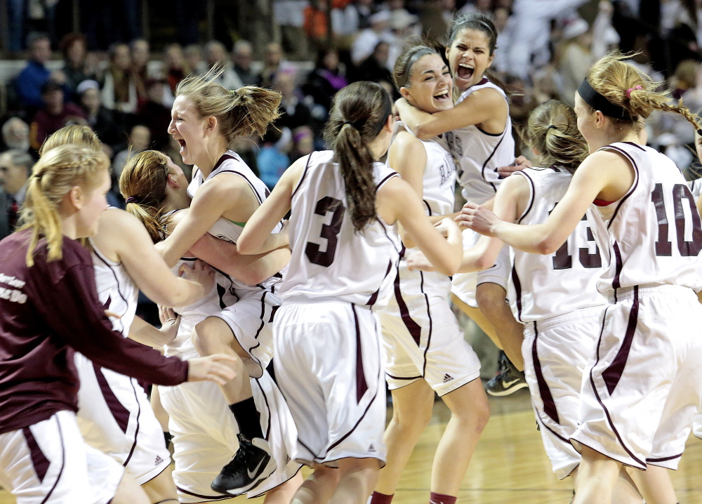 Greely celebrates after beating Presque Isle 56-39 to win the Class B girls’ basketball state title on Friday at Cross Insurance Arena in Portland. Gabe Souza/Staff photographer