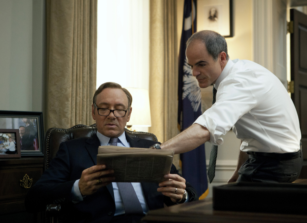 Kevin Spacey, left, and Michael Kelly appear in a scene from “House of Cards.” The third season of the political drama became available on Netflix on Friday.