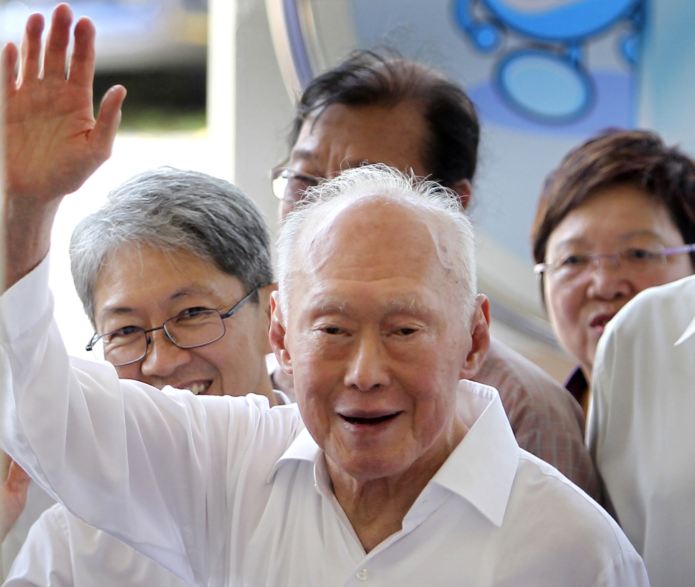 Singapore’s Minister Mentor Lee Kuan Yew waves to supporters as he arrives at an elections nomination center in Singapore in April 2011. Singapore’s government says the condition of Lee, the country’s 91-year-old founding father, has improved slightly as he remains on life support in intensive care, where he is being treated for severe pneumonia.