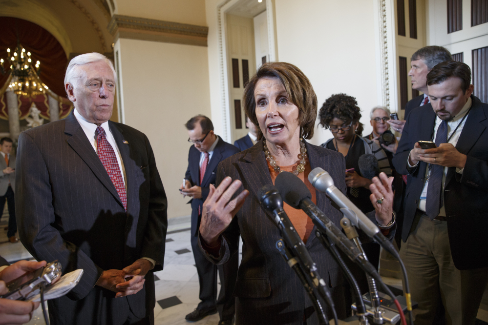 House Minority Leader Nancy Pelosi of Calif., accompanied by House Minority Whip Steny Hoyer of Md., gestures during a news conference on Capitol Hill in Washington on Friday to voice their objections to the Republican majority during a delay in voting for a short-term spending bill for the Homeland Security Department that would avert a partial agency shutdown hours before it was to begin.