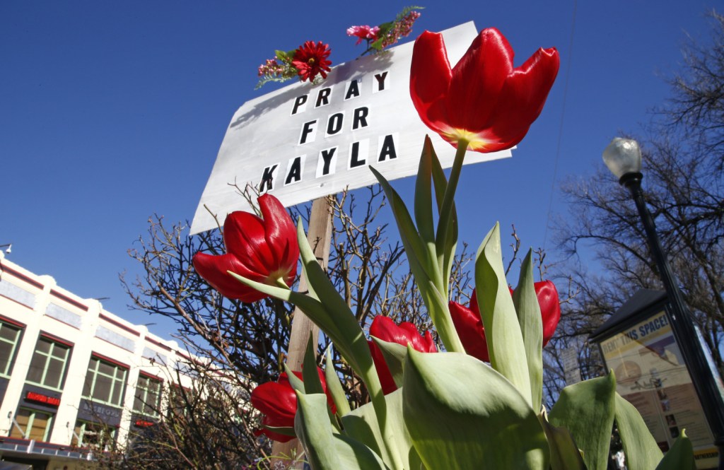 A memorial for Kayla Mueller is seen Tuesday in Prescott, Ariz. Mueller, a 26-year-old American who was held by Islamic State militants, has been confirmed dead, her parents and the Obama administration said Tuesday as the White House prepared to request new war powers from Congress.