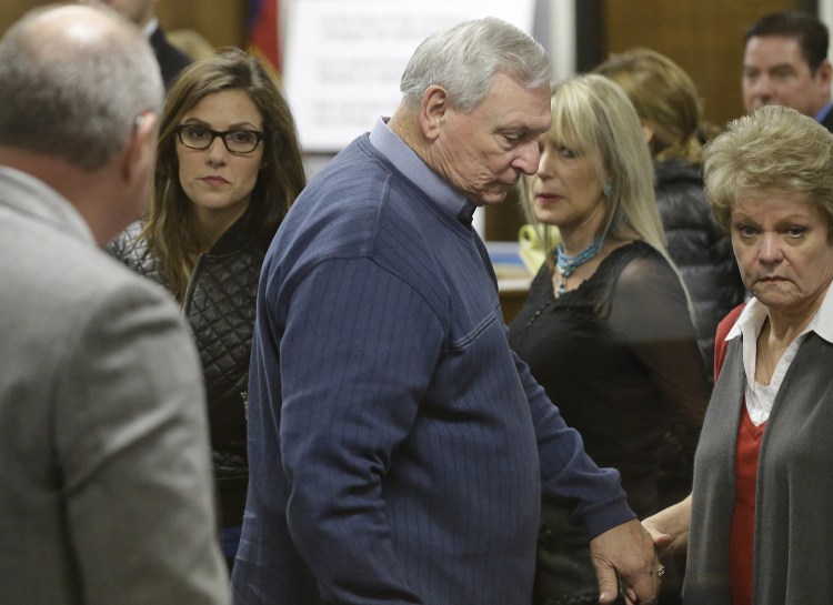 Taya Kyle, left, wife of former Navy SEAL Chris Kyle, follows Don and Judy Littlefield, parents of Chad Littlefield, out of the courtroom after a break in the capital murder trial of Eddie Ray Routh Friday in Stephenville, Texas.  Routh is charged in the 2013 deaths of Kyle and Littlefield at a shooting range near Glen Rose, Texas.