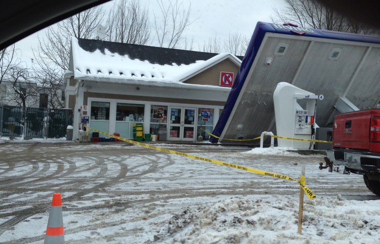 The awning at the Irving gas station in downtown Conway, N.H., collapsed Thursday morning as workers were shoveling off snow.
