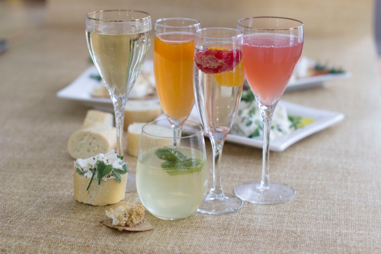 Sparkling wine cocktails, from left: Rhubarb, honey bourbon, crushed, ruby and mojiito.