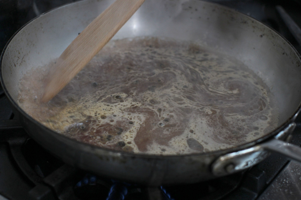 Deglazing the pan to make the sauce