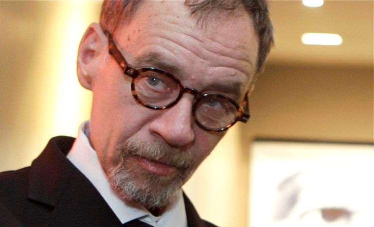 New York Times journalist David Carr arrives for the French premiere of the documentary "Page One: A Year Inside The New York Times," in Paris, in this In this Nov. 21, 2011, photo. Carr wrote the Media Equation column for the Times, focusing on issues of media in relation to business and culture. The Associated Press