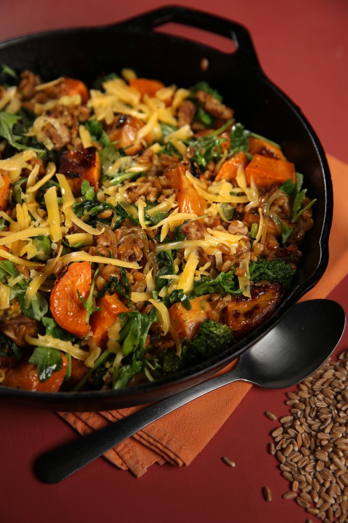 A farro-based recipe gets support from roasted sweet potatoes, broccoli rabe, cheese and Italian sausage.