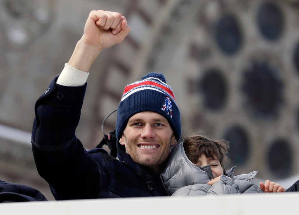 New England Patriots quarterback Tom Brady waves during a parade in Boston on Wednesday to honor the Patriots' victory over the Seattle Seahawks in Super Bowl XLIX Sunday in Glendale, Ariz. 