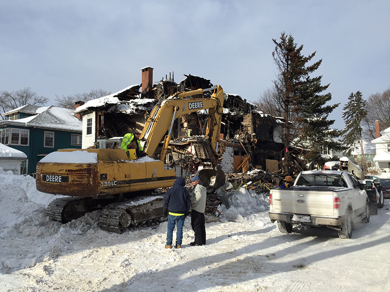 The scene on Noyes Street in Portland on Friday morning as crews demolished the fire-gutted house.