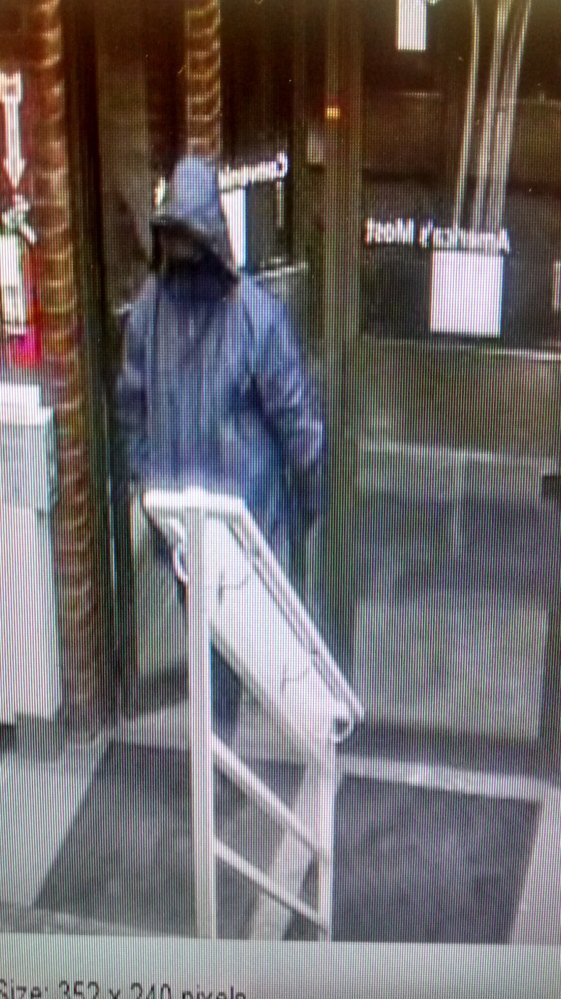 A security camera captured this photograph of the man police say robbed the TD Bank on Main Street in downtown Waterville on Thursday. The man wore a black cap and full face mask, and is described as being about 6 feet tall and weighing about 250 pounds.