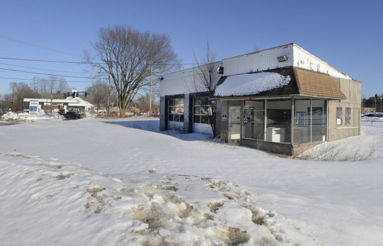 Officials have a plan to replace this old gas station at 109 Main St. in Gorham.  John Patriquin/Staff Photographer