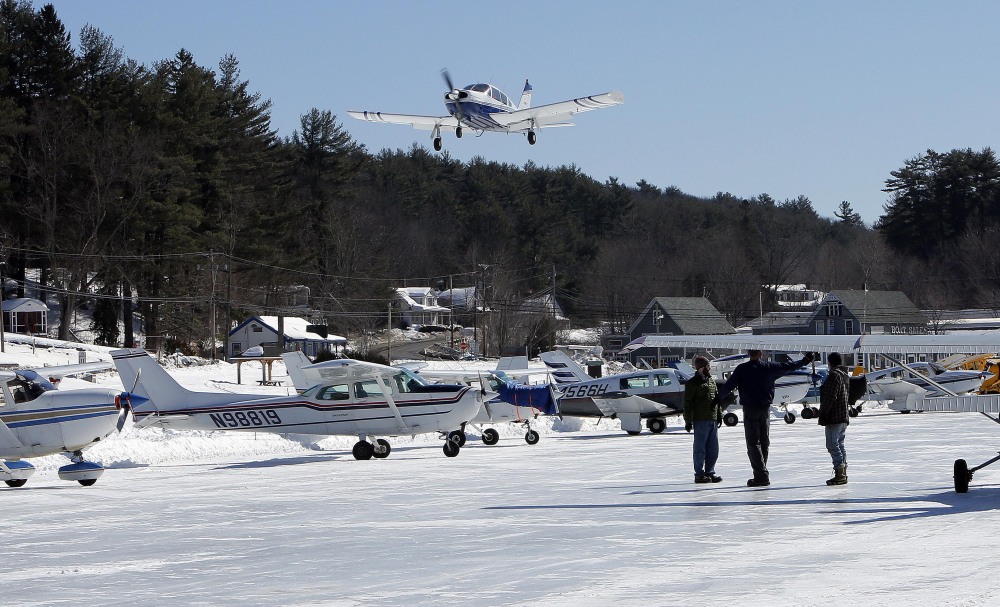 A plane flies onto the ice runway on New Hampshire’s Lake Winnipesaukee on Saturday.