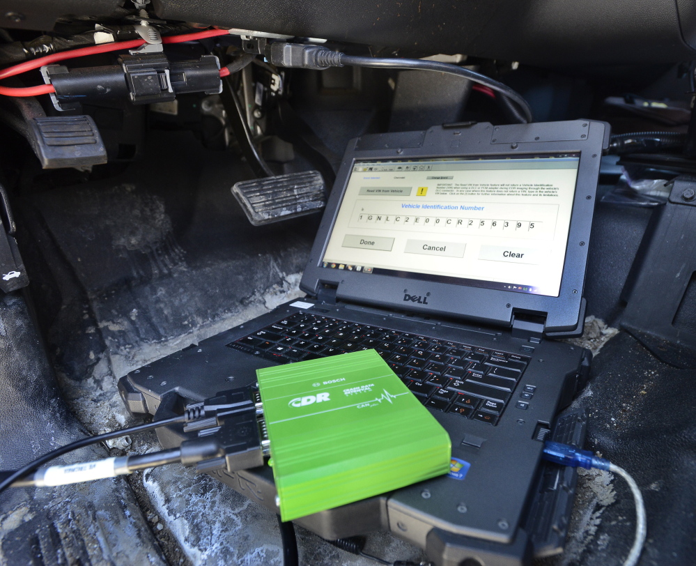 This green device is a crash retrieval tool, which can be hooked up through a laptop computer to access and capture data from a vehicle’s event data recorder. John Patriquin/Staff Photographer