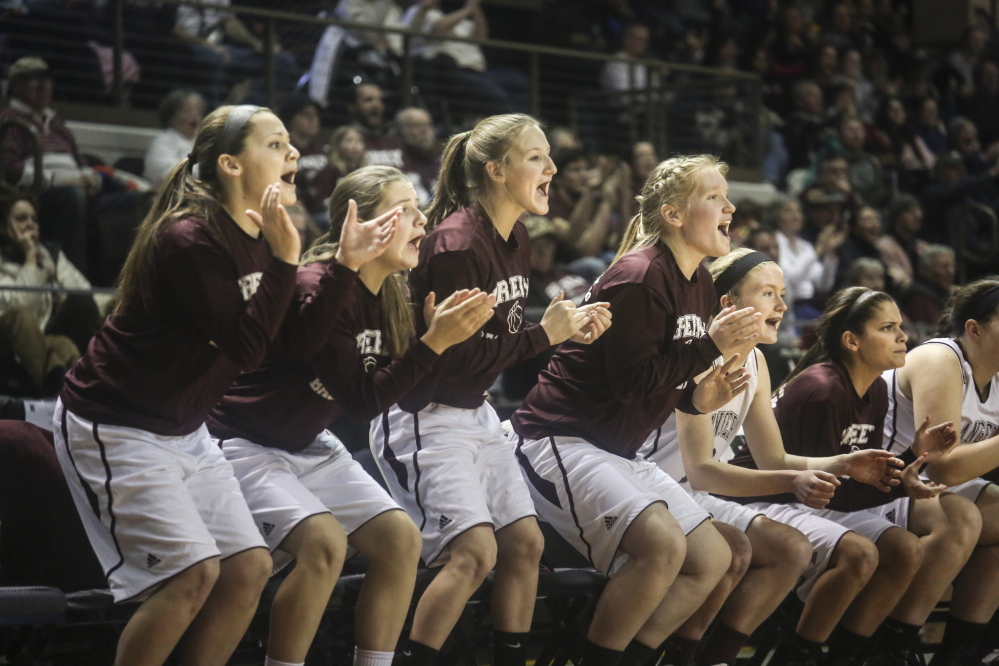 The Greely girls basketball team cheers during the last minutes of the Class B state championship game at the Cross Insurance Arena in Portland on Friday.
Whitney Hayward/Staff Photographer