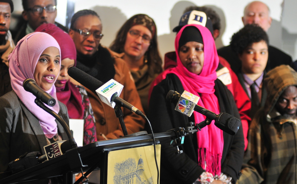 Mouna Ismail, left, of the United Somali Women of Maine, expresses her opposition at a news conference Tuesday before a hearing on Gov. Paul LePage’s proposals to change the General Assistance program.