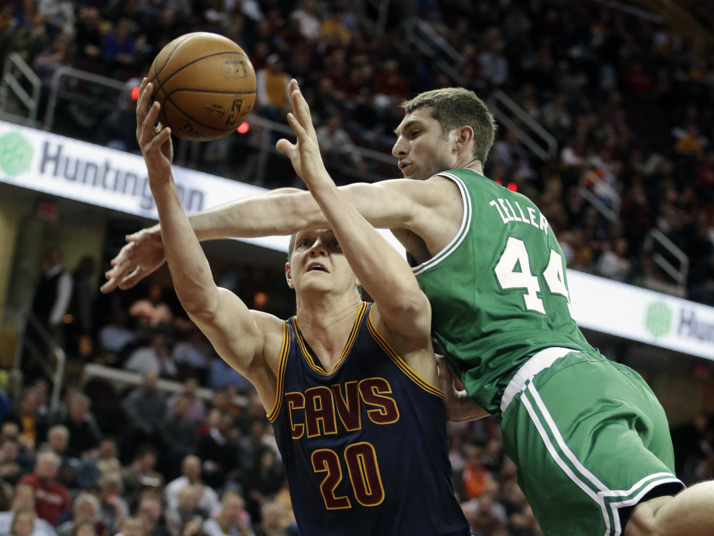 The Celtics’ Tyler Zeller fouls Cleveland’s Timofey Mozgov in the first quarter of Tuesday night’s game in Cleveland. Boston lost by 31 points, its largest margin of this season.
The Associated Press
