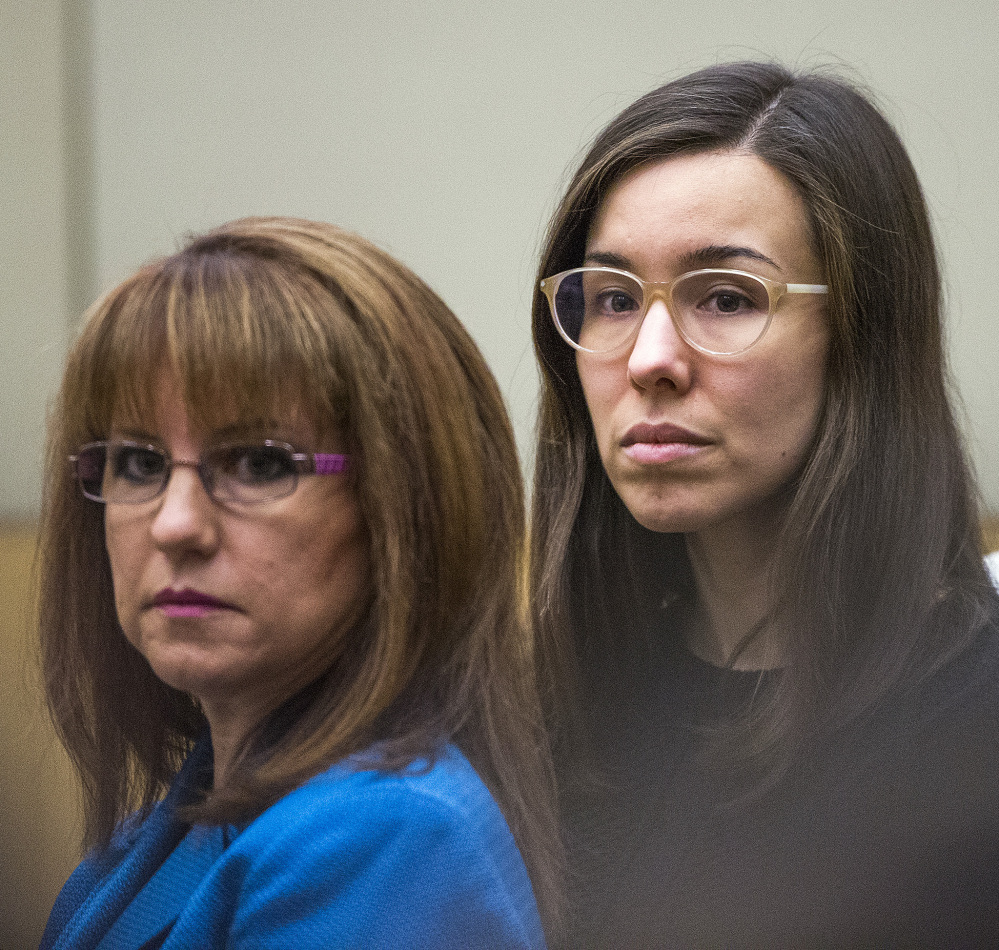 Jodi Arias, right, watches jurors enter the courtroom before hearing their verdict.