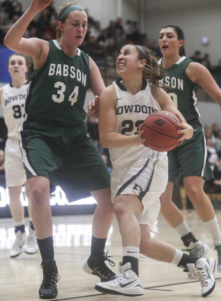 Sara Binkhorst, who had 16 of her game-high 19 points for Bowdoin in the second half, goes for a layup as Ashley Snyder, left, and Linnett Graber defend for Babson. Bowdoin moved on in the NCAA tourney, 70-57.