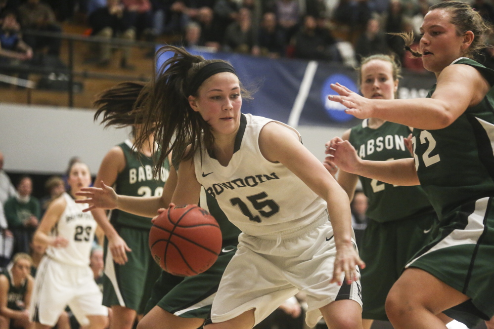 Bowdoin guard Marle Curle is surrounded by Babson defenders as she looks for an open teammate Friday during a first-round game of the NCAA Division III women’s basketball tournament in Brunswick. Curle scored 16 points as the Polar Bears advanced with a 70-57 win.