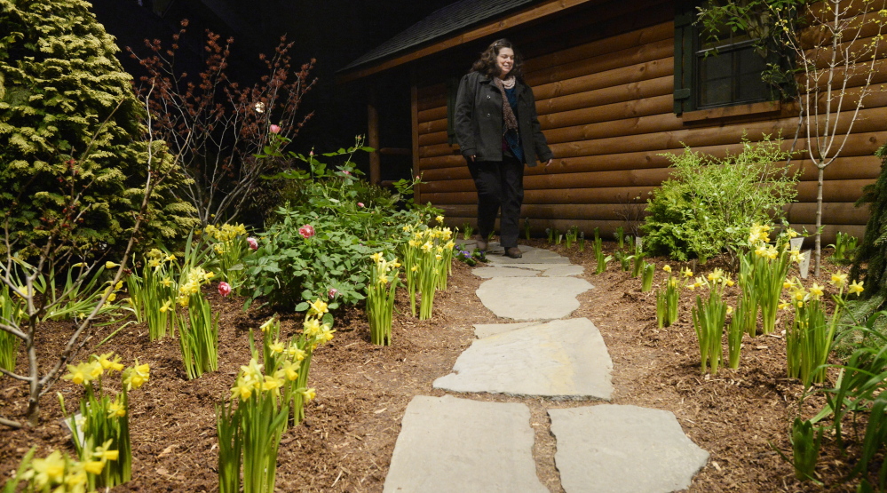 Jane Dyer of Portland navigates a stone walkway – no icy surfaces here – at the Portland Flower Show on Friday. 