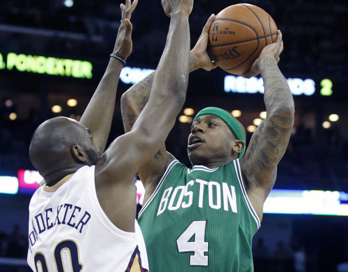 Celtics guard Isaiah Thomas shoots over New Orleans guard Quincy Pondexter in the second half of Friday night’s game in New Orleans. The Celtics defeated the Pelicans, 104-98.