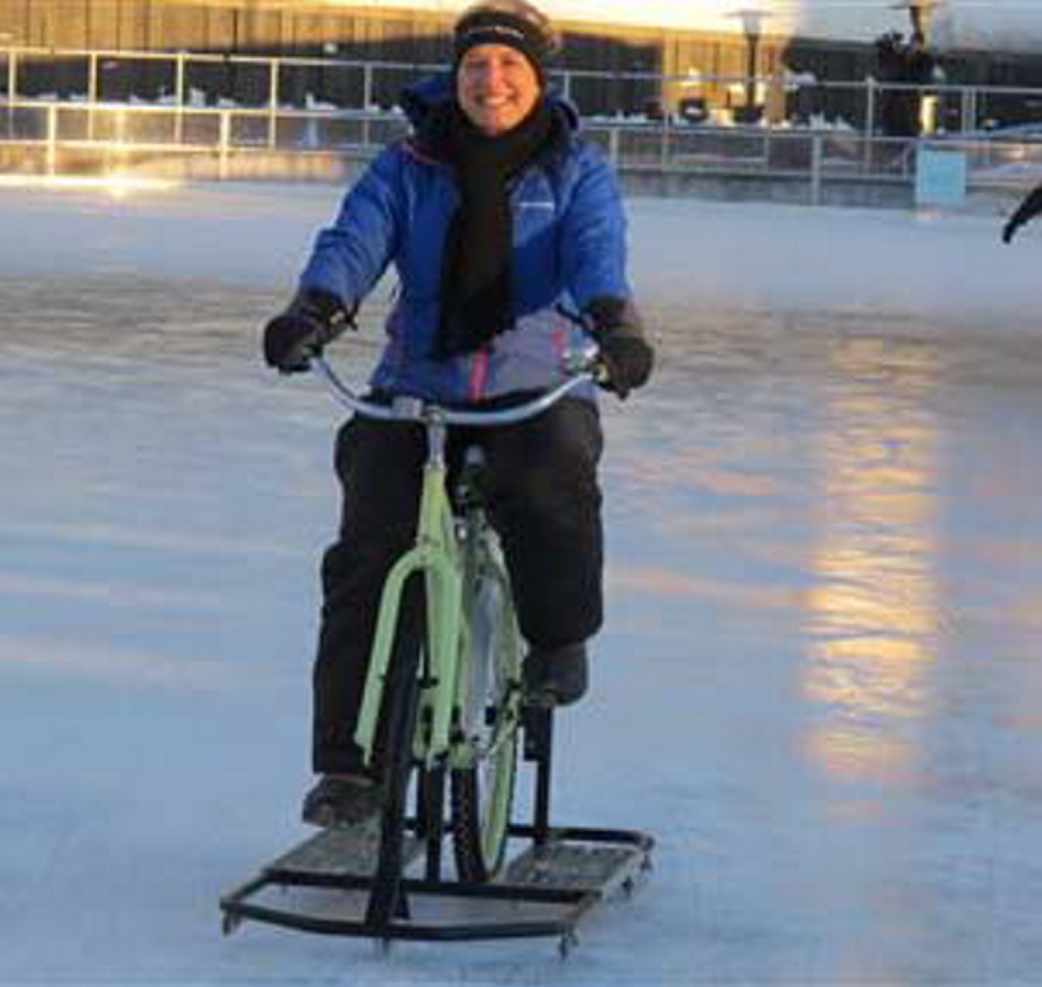 Lisa Florczak, founder of Ice Bikes of Buffalo, rides one of her inventions at the Ice at Canalside in Buffalo, N.Y.