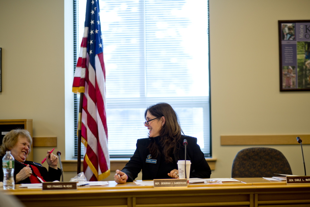 State Rep. Deborah Sanderson, right, talks with Rep. Frances M. Head, R-Bethel, before a February hearing at the Cross State Office Building in Augusta. In 2009, Sanderson opposed expanding Maine’s Medical Marijuana Act, but after research years later, she changed her position.