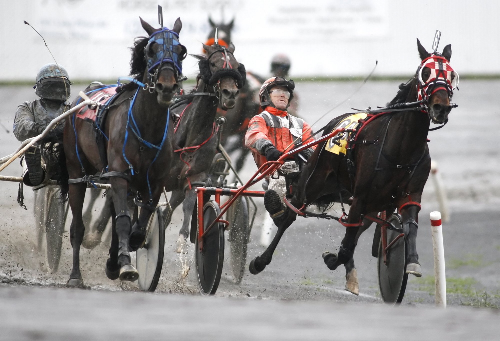 Harness-racing drivers compete at Scarborough Downs. 