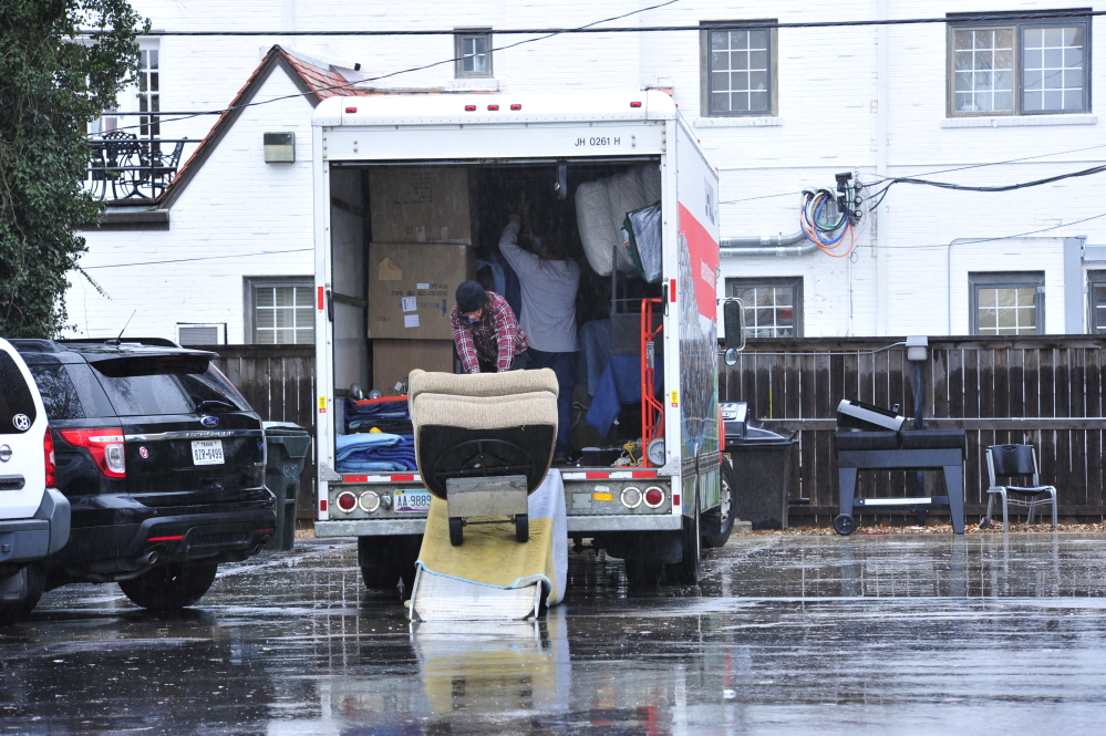Students at the Sigma Alpha Epsilon house load up a moving truck with their belongings at the University of Oklahoma on Monday in Norman, Okla.