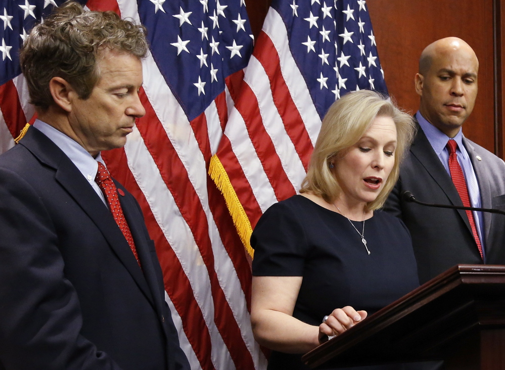 U.S. Sens. Rand Paul, left, Kirsten Gillibrand and Cory Booker, in Washington on Tuesday, said their unusual bipartisan coalition is a sign of growing acceptance of medical marijuana.