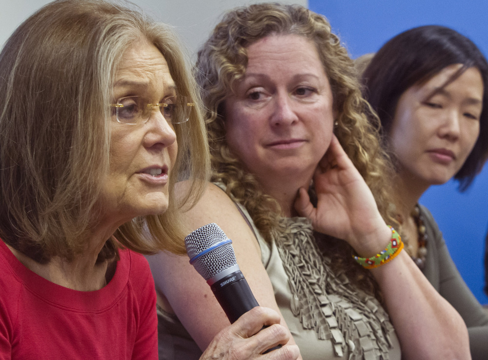 Gloria Steinem, left, holds a United Nations news conference Wednesday announcing plans to walk across the demilitarized zone.