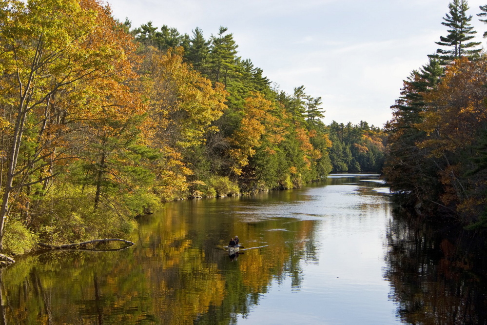 A couple canoes on the Saco River in Hollis in 2007. Land for Maine’s Future helped the town buy this stretch of land to protect it from development. Gov. LePage has yet to release bond money for over two dozen other LMF projects approved by voters in 2010 and 2012.
