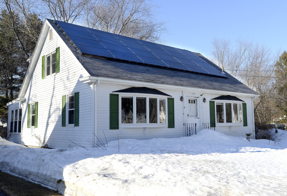 The roof of this home at 103 Wolcott St. in Portland has been fitted with solar panels. At least four bills to be considered by the Legislature would create incentives for solar energy.
