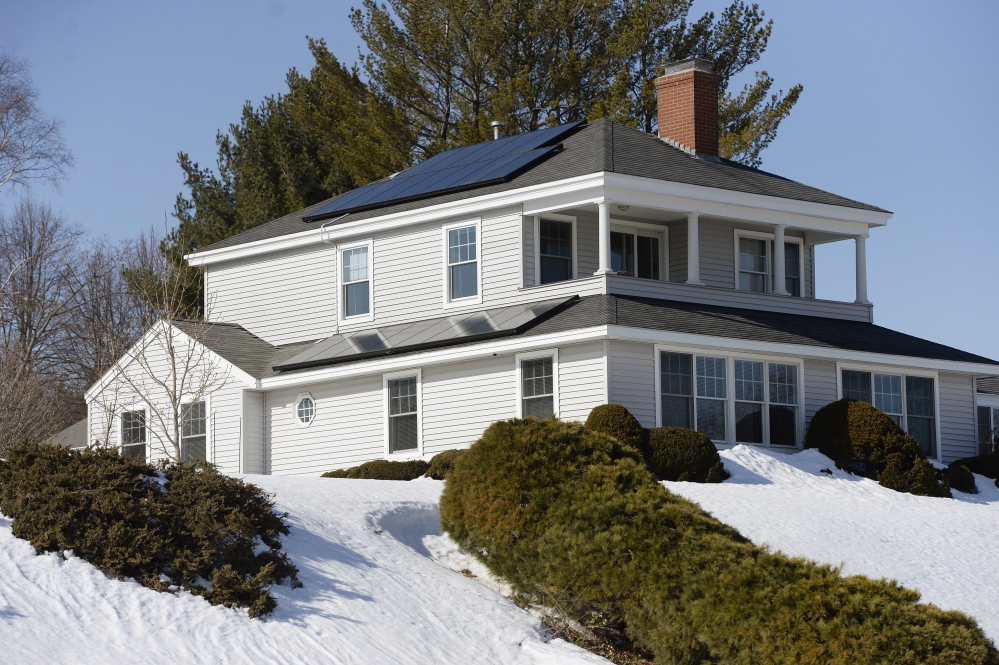 A home on Clifton Street in Portland is outfitted with solar panels. Gov. Paul LePage has opposed subsidies for renewable energy because he says they raise electric rates.