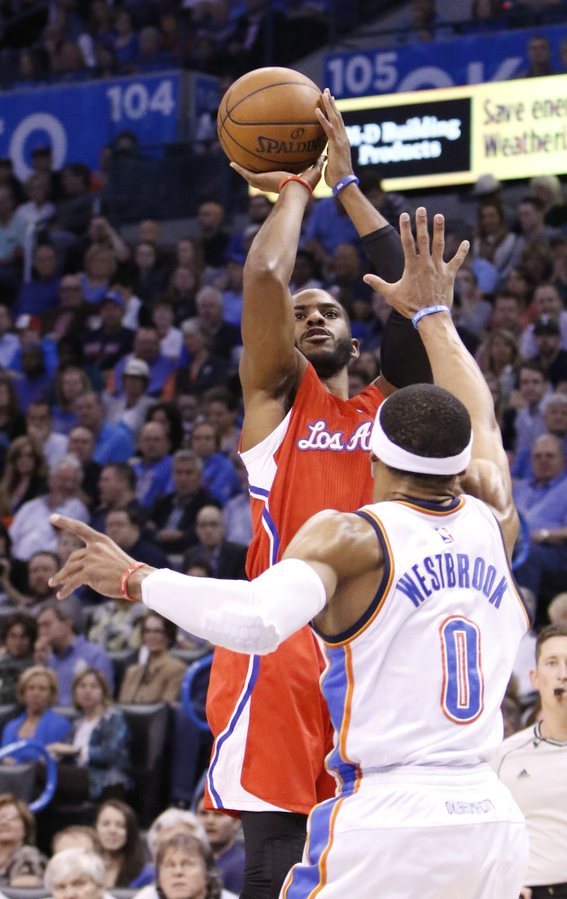 Chris Paul, who had 33 points for the Los Angeles Clippers, shoots over Russell Westbrook of the Oklahoma City Thunder during the Clippers’ 120-108 victory.