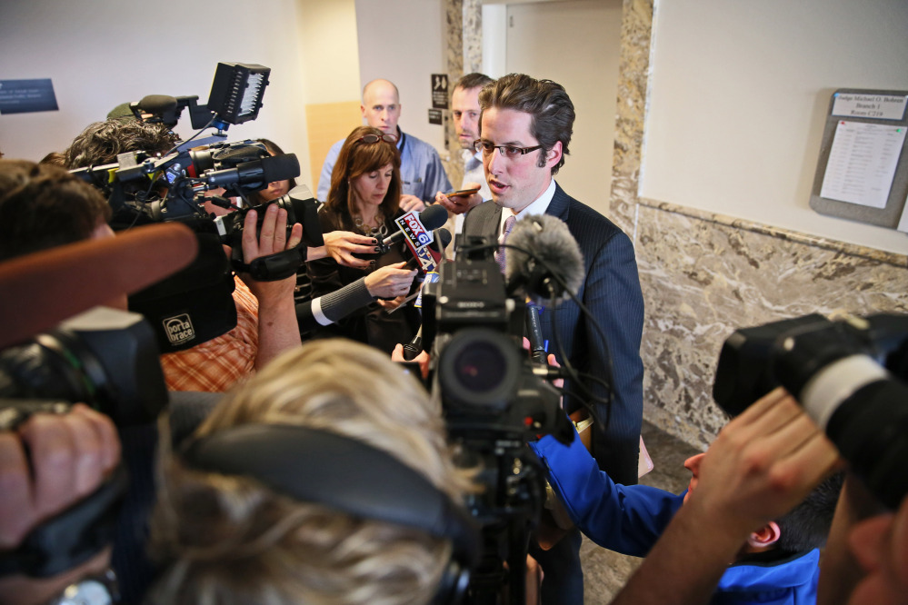 Defense attorney Anthony Cotton speaks to reporters in Milwaukee on Friday after a judge decided to try the two 12-year-old suspects in the Slenderman stabbing case as adults.