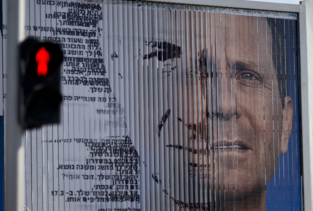 An election campaign billboard shifts between images of Isaac Herzog, leader of the Labor Party, right, and Israel’s Prime Minister Benjamin Netanyahu and leader of the Likud Party, in Tel Aviv, Israel.