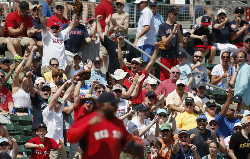 Red Sox fans give new third baseman Pablo Sandoval a big cheer after Sandoval threw out Pittsburgh’s Tony Sanchez in the fourth inning of Boston’s 5-3 loss Saturday in Fort Myers, Florida.