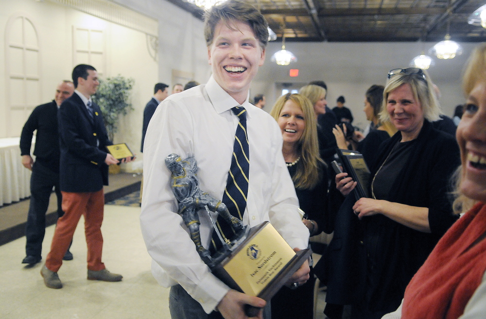 Falmouth’s Isac Nordstrom is all smiles after winning the Travis Roy Award Sunday at a ceremony in Lewiston.