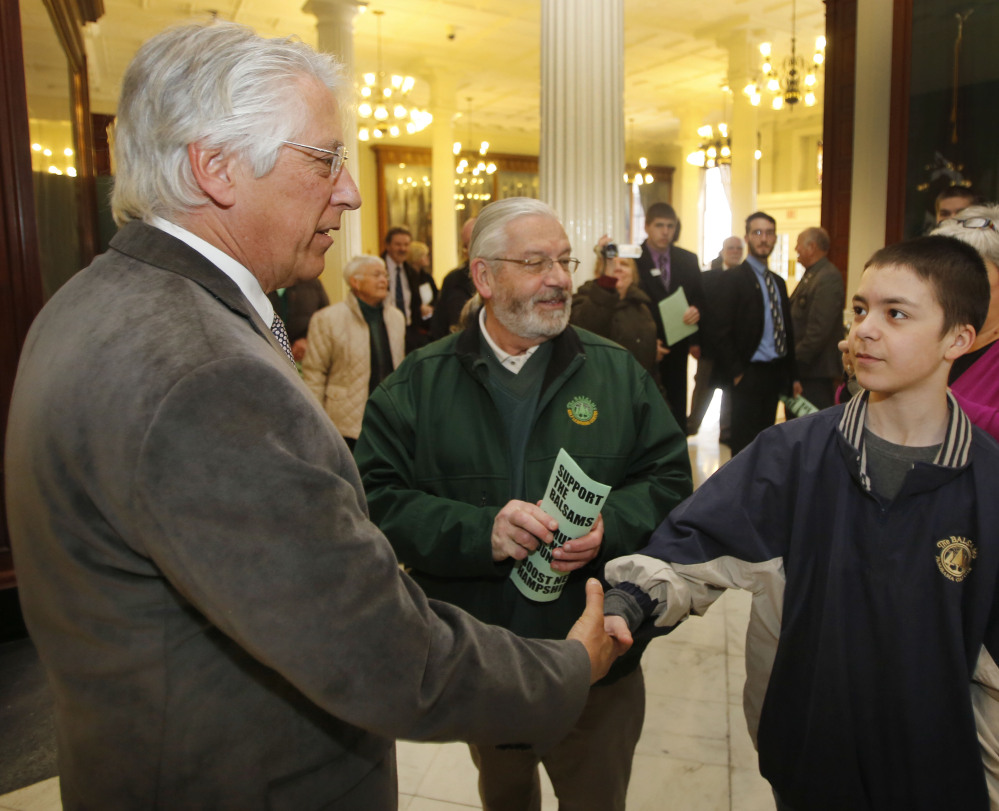 Entrepreneur Less Otten, left, greets a group of New Hampshire students and businesspeople in March as part of his effort to win a state-backed $28 million bond to help redevelop the Balsams resort in Dixville Notch.