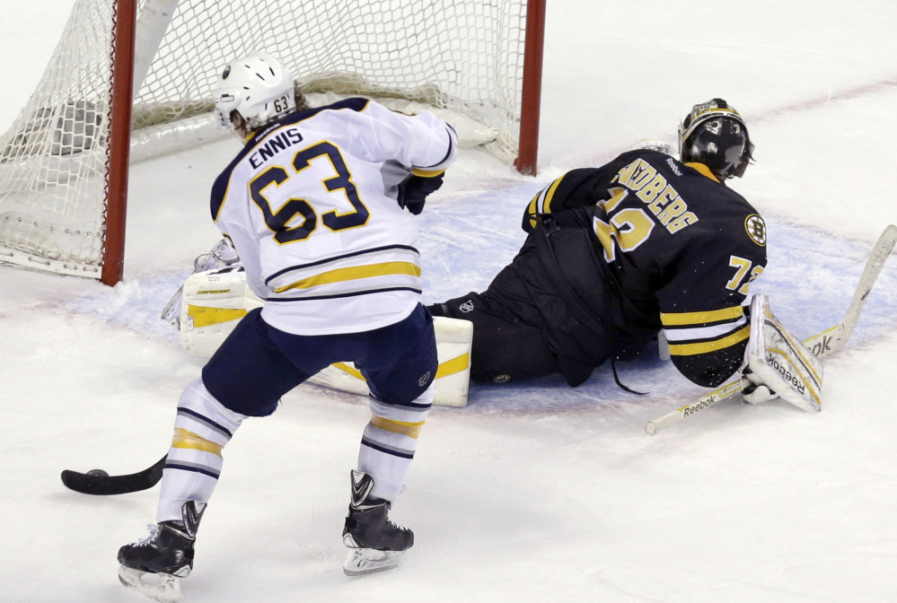 Buffalo Sabres left wing Tyler Ennis has Boston Bruins goalie Niklas Svedberg faked out and turned away as Ennis scores during the shootout in overtime of Tuesday night’s game in Boston. The Sabres won 2-1.