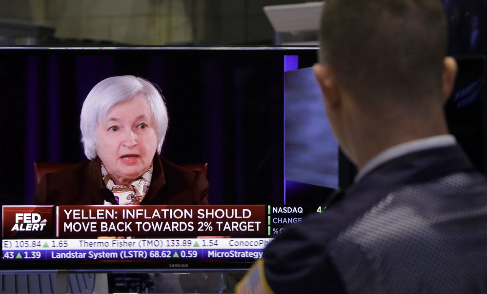 A trader on the floor of the New York Stock Exchange watches Federal Reserve Chair Janet Yellen’s news conference Wednesday.