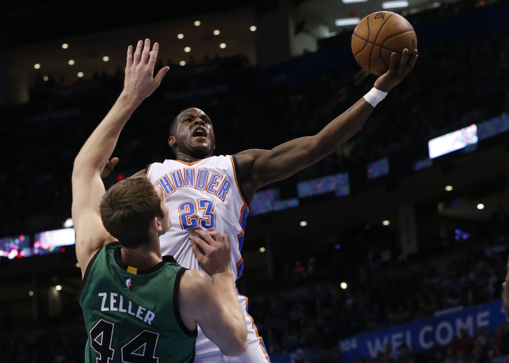 Oklahoma City Thunder guard Dion Waiters shoots as Celtics center Tyler Zeller defends in the first quarter of Wednesday night’s game in Oklahoma City. The Thunder snapped Boston’s five-game winning streak.