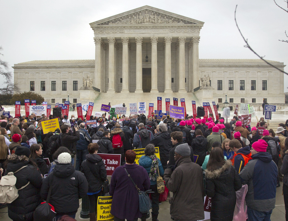 A crowd gathers outside the Supreme Court on March 4 while the court was hearing arguments in a case targeting health insurance subsidies under President Obama’s health care law. Maine legislators are considering a bill to protect those subsidies for nearly 67,000 Mainers.