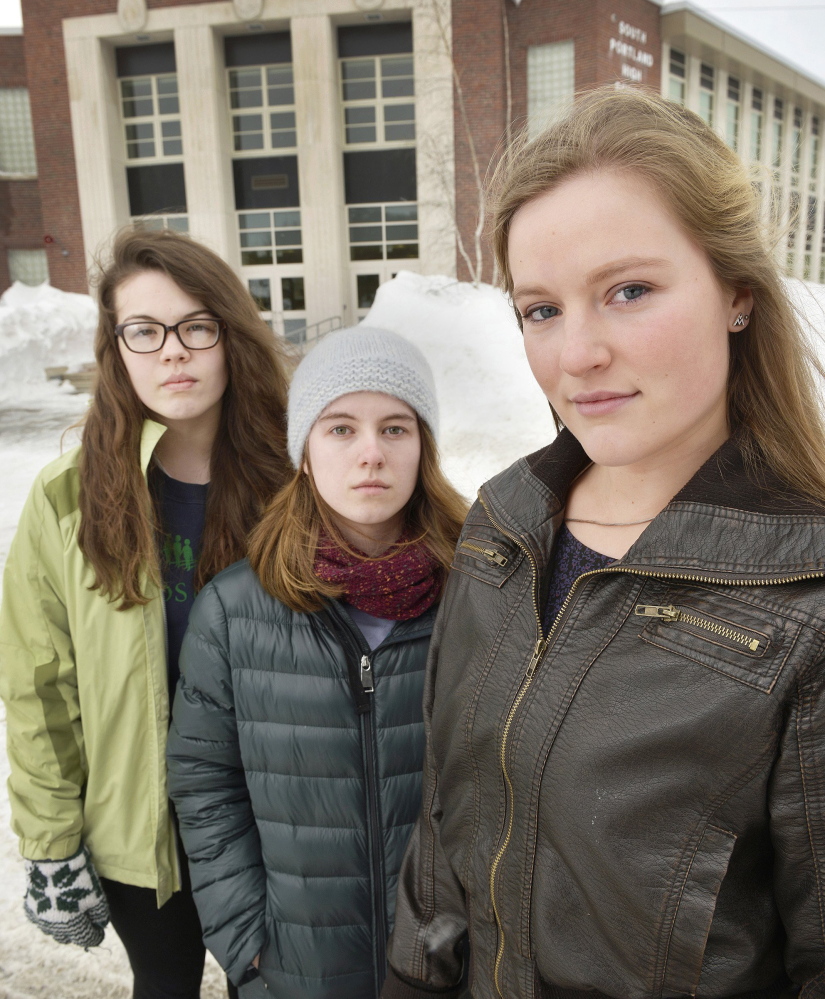 Lily SanGiovanni, right, South Portland High’s senior class president, and two of her supporters, Morrigan Turner, left, and Gaby Ferrell, appeared before the faculty leadership team Thursday.