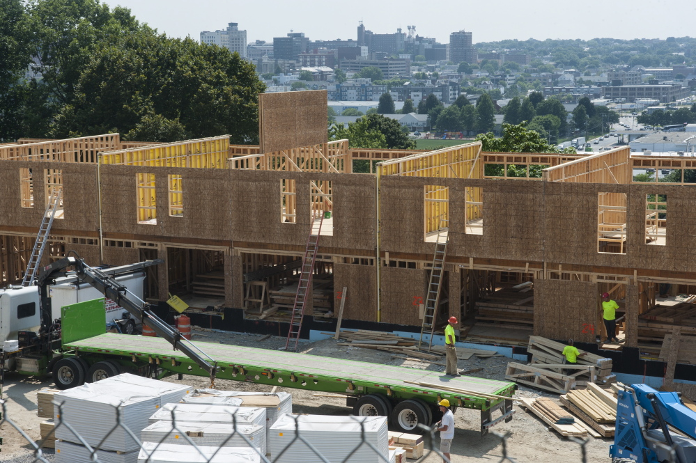 Infill development on the Portland peninsula, even luxury projects like this Munjoy Hill complex, is needed to take the pressure off an overheated housing market that is putting housing in the city out of reach for the middle class. Logan Werlinger/Staff Photographer