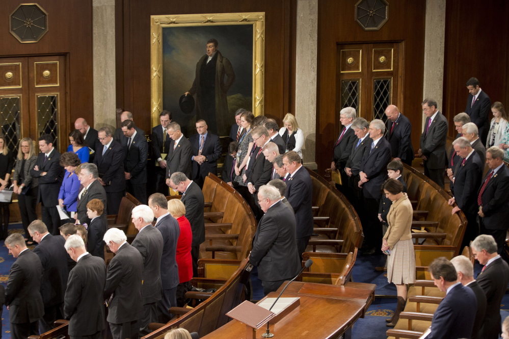 Members of the U.S. House of Representatives bow their heads during a prayer opening a session on Capitol Hill in Washington. Any member can invite a guest chaplain to conduct opening prayers. The House chaplain advises guests to keep their prayers short and to be sensitive to non-Christians.