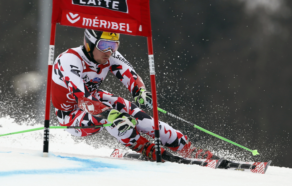 Marcel Hirscher, of Austria, powers past a gate during the first run of the men’s World Cup giant slalom race at the World Cup finals in Meribel, France, on Saturday.